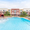 large swimming pool in center of apartment building